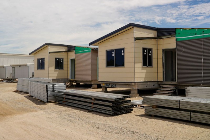 Modular transportable buildings staged on a precision assembly yard